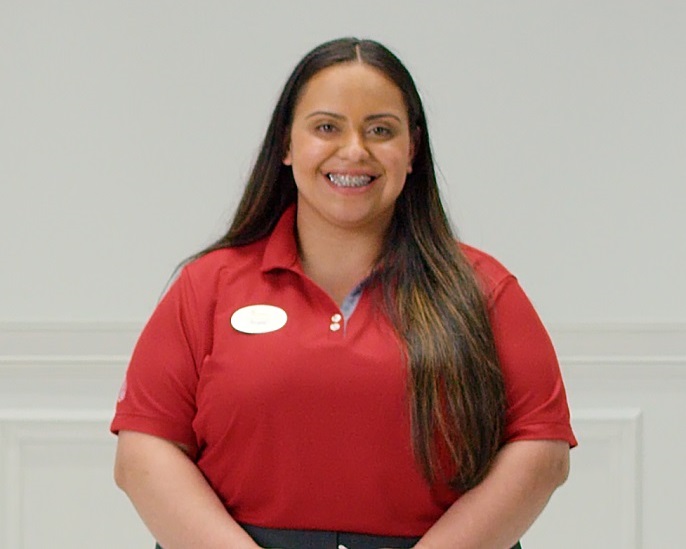 Angelique, a Team Member in uniform facing forward and smiling